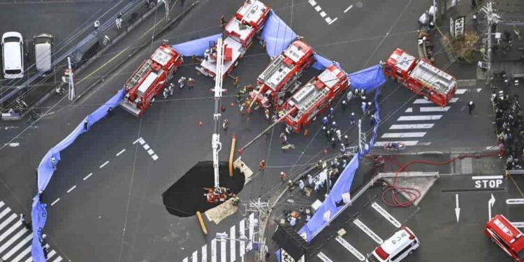 Rescue Operation Underway for Driver Trapped in Growing Sinkhole Near Tokyo - Kenichiro Kojima/AP Photo