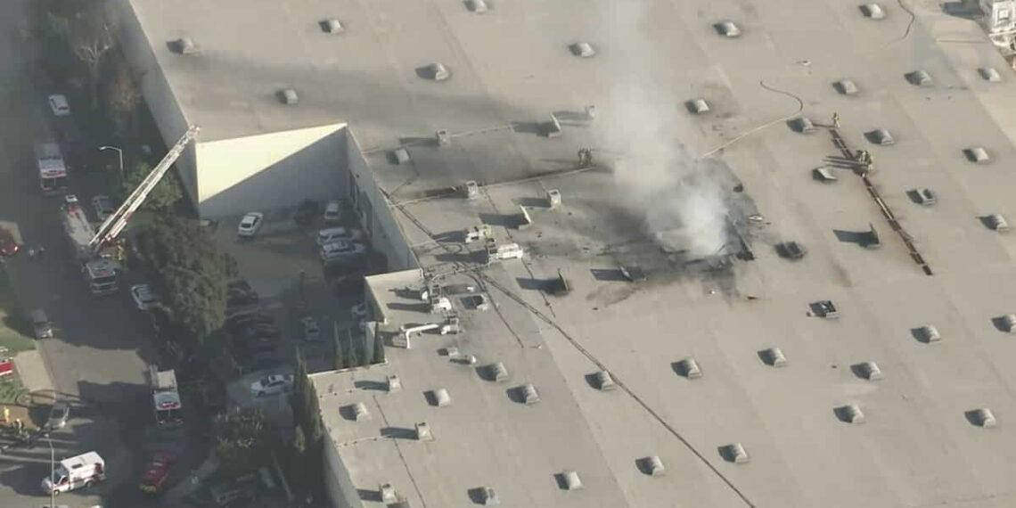 Deadly Plane Crash Sparks Fire Near Fullerton Municipal Airport - he roof of a furniture manufacturing facility where a plane crashed on Thursday, Jan. 2, 2024. (KTLA)