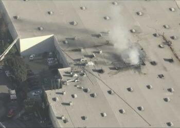 Deadly Plane Crash Sparks Fire Near Fullerton Municipal Airport - he roof of a furniture manufacturing facility where a plane crashed on Thursday, Jan. 2, 2024. (KTLA)