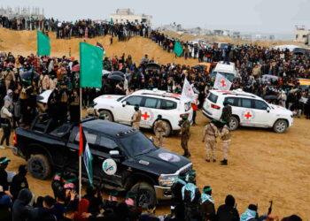 Gaza Handover: Bodies of Two Young Hostages Spark National Grief - Hatem Khaled/REUTERS