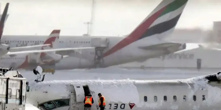 Inside the Toronto Plane Crash: One Passenger’s Unbelievable Escape - Chris Young/The Canadian Press/AP