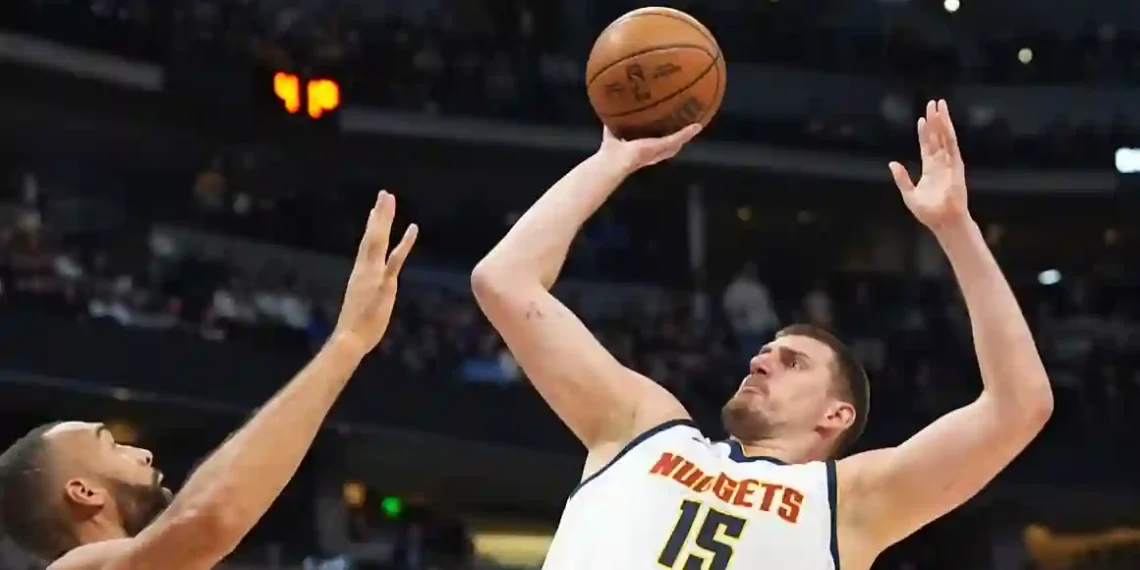Jokić Sets Record with 61 Points, But Nuggets Lose in Double Overtime Classic - David Zalubowski/AP via CNN
