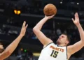 Jokić Sets Record with 61 Points, But Nuggets Lose in Double Overtime Classic - David Zalubowski/AP via CNN