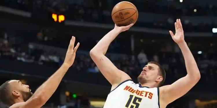 Jokić Sets Record with 61 Points, But Nuggets Lose in Double Overtime Classic - David Zalubowski/AP via CNN