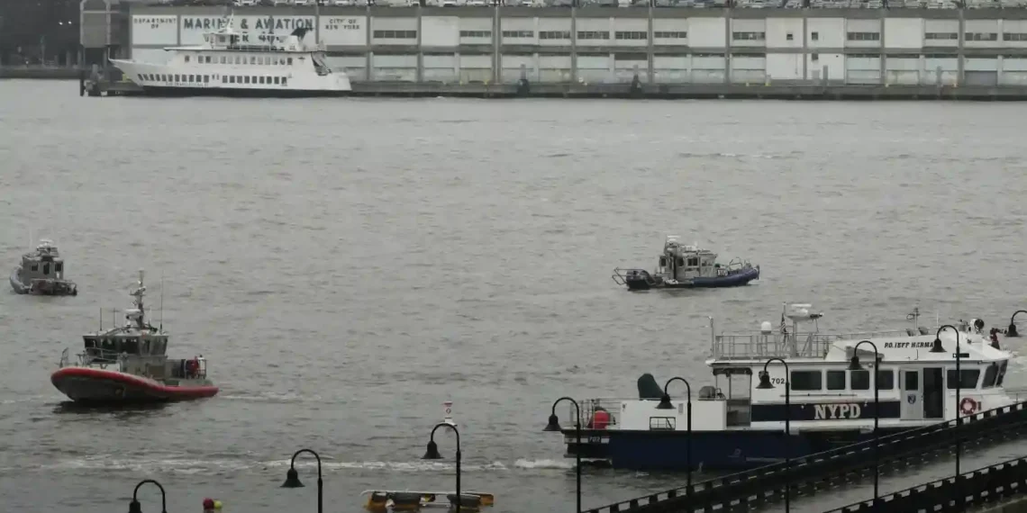 Helicopter Breaks Apart Midair, Crashes Into Hudson—6 Killed - Seth Wenig/AP Photo