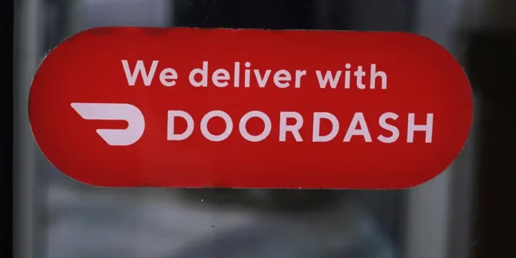 DoorDash Reports Record Earnings and Expands into New Markets - AP Photo/Charles Krupa, File
