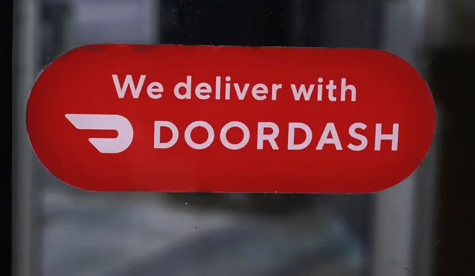 DoorDash Reports Record Earnings and Expands into New Markets - AP Photo/Charles Krupa, File