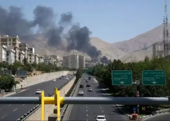 Iran on Edge: Posters Warn Citizens to Report Sunglasses, Screams, and Packages - Vahid Salemi/AP