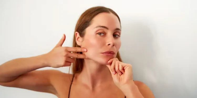 The Truth About Face Yoga, According to Dermatologists - Oscar Gutierrez Zozulia/iStockphoto/Getty Images