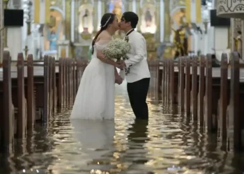 Typhoon Wipha Can’t Stop This Wedding: A Flooded Ceremony in the Philippines - AP Photo/Aaron Favila