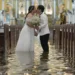 Typhoon Wipha Can’t Stop This Wedding: A Flooded Ceremony in the Philippines - AP Photo/Aaron Favila