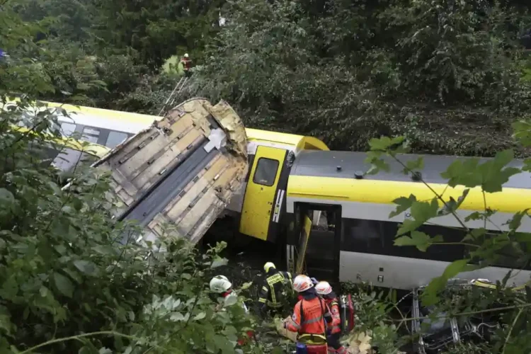 Train Derails in Forested Area of Germany—Landslide Possible Cause, Officials Say - Thomas Warnack/dpa via AP