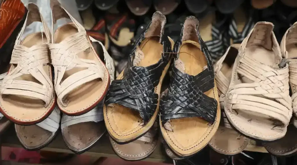 Adidas and Designer Willy Chavarria Issue Apologies Over Sandal Design Criticized for Copying Zapotec Huarache Style Without Consent - AP Photo/Luis Alberto Cruz
