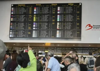 Cyberattack Disrupts Check-In Systems at Brussels, Berlin, and London Airports, Causing Flight Delays and Manual Boarding Measures - AP Photo/Harry Nakos