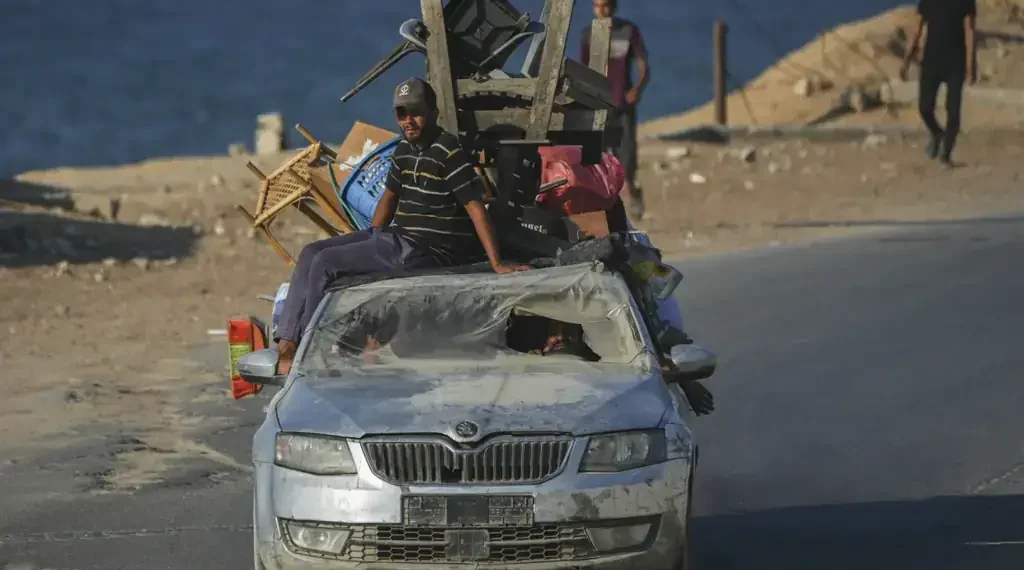 Gaza City residents told to flee south as Israeli military targets high-rise towers, deepening displacement and fueling famine warnings. - AP Photo/Jehad Alshrafi
