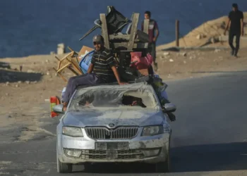 Gaza City residents told to flee south as Israeli military targets high-rise towers, deepening displacement and fueling famine warnings. - AP Photo/Jehad Alshrafi