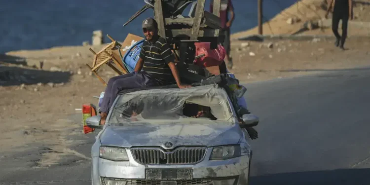 Gaza City residents told to flee south as Israeli military targets high-rise towers, deepening displacement and fueling famine warnings. - AP Photo/Jehad Alshrafi