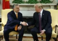 Trump applauds Jimmy Kimmel’s suspension as part of broader campaign against media, raising concerns of parallels with authoritarian tactics. - AP Photo/Evan Vucci, File