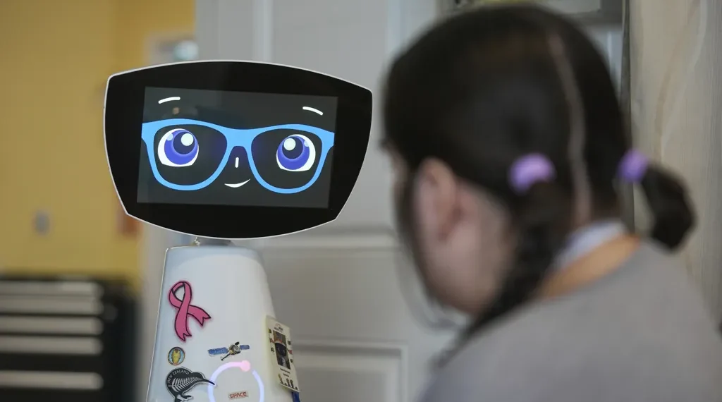AI Robot Robin Comforts Pediatric Patients and Nursing Home Residents While Supporting Overworked Medical Staff in U.S. Hospitals - AP Photo/Damian Dovarganes