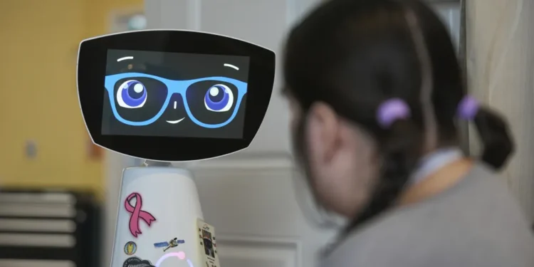 AI Robot Robin Comforts Pediatric Patients and Nursing Home Residents While Supporting Overworked Medical Staff in U.S. Hospitals - AP Photo/Damian Dovarganes