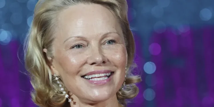 Pamela Anderson Inspires Women to Go Makeup-Free, Challenging Beauty Norms and Empowering Authentic Self-Expression - AP Photo/Kirsty Wigglesworth