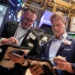 Wall Street eases as stocks retreat from record highs; Fed Chair warns valuations are stretched while gold prices set new records. - AP Photo/Richard Drew