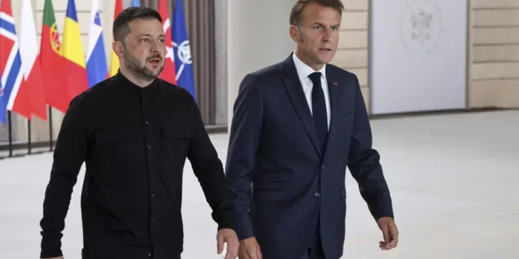 Macron says 26 nations pledge to join post-war reassurance force in Ukraine, with U.S. support under discussion to strengthen long-term security. - Ludovic Marin/Pool Photo via AP