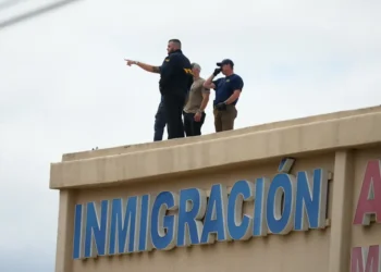 Dallas ICE facility shooting leaves one detainee dead, two injured as gunman opens fire from rooftop before taking his own life. - AP Photo/Julio Cortez
