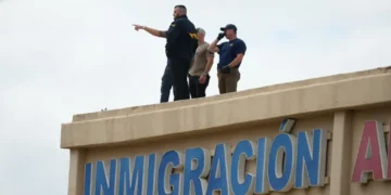 Dallas ICE facility shooting leaves one detainee dead, two injured as gunman opens fire from rooftop before taking his own life. - AP Photo/Julio Cortez