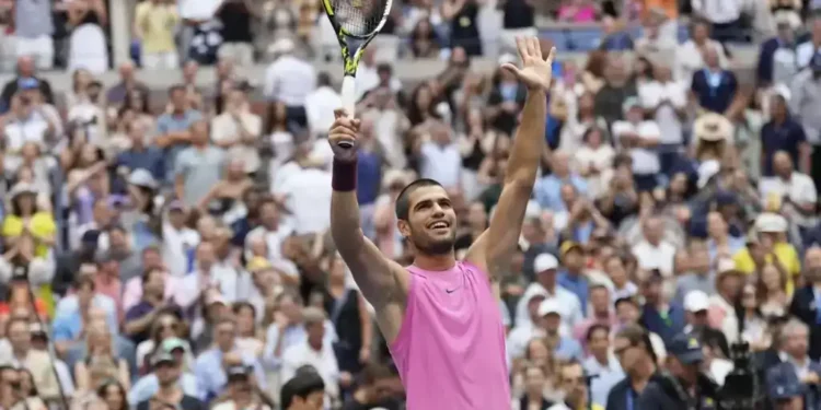 Alcaraz overpowers Djokovic 6-4, 7-6, 6-2 at U.S. Open semifinal, advancing to third straight major final in dominant performance. - AP Photo/Seth Wenig