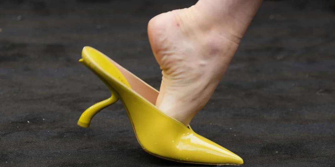 Ferragamo unveils 1920s-inspired co-ed collection at Milan Fashion Week with chartreuse bags, shoes, and bold vintage tailoring - AP Photo/Luca Bruno