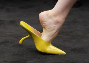 Ferragamo unveils 1920s-inspired co-ed collection at Milan Fashion Week with chartreuse bags, shoes, and bold vintage tailoring - AP Photo/Luca Bruno