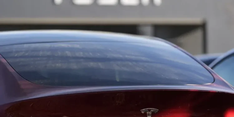 Tesla Launches Cheaper Model 3 and Model Y to Boost Slowing EV Sales - AP Photo/Mike Stewart, File