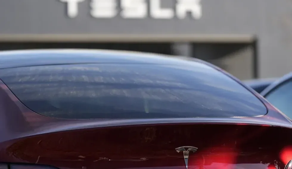 Tesla Launches Cheaper Model 3 and Model Y to Boost Slowing EV Sales - AP Photo/Mike Stewart, File