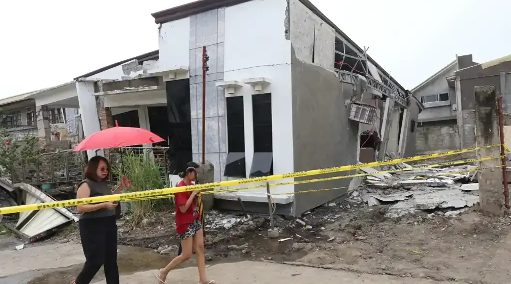 Twin Quakes Strike Southern Philippines, Killing Seven and Triggering Tsunami Alert - AP Photo/Manman Dejeto