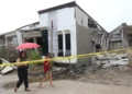 Twin Quakes Strike Southern Philippines, Killing Seven and Triggering Tsunami Alert - AP Photo/Manman Dejeto