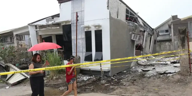 Twin Quakes Strike Southern Philippines, Killing Seven and Triggering Tsunami Alert - AP Photo/Manman Dejeto