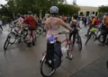 Portland Protesters Stage Naked Bike Ride to Oppose Federal Troop Deployment - AP Photo/Jenny Kane