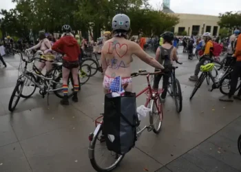 Portland Protesters Stage Naked Bike Ride to Oppose Federal Troop Deployment - AP Photo/Jenny Kane