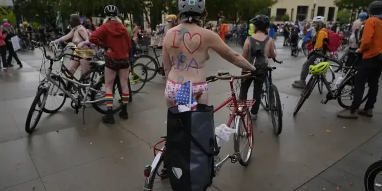 Portland Protesters Stage Naked Bike Ride to Oppose Federal Troop Deployment - AP Photo/Jenny Kane