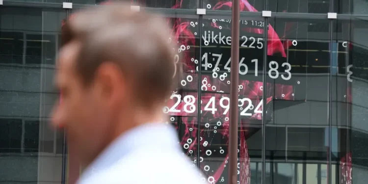 Global Stocks Slide as Bank Loan Fears and Trade Tensions Deepen - AP Photo/Eugene Hoshiko