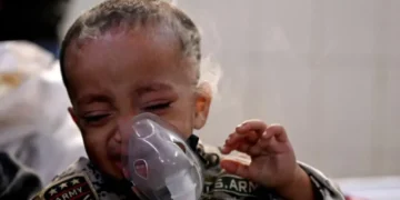 Children wear masks outdoors in Delhi smog - AFP via Getty Images/BBC