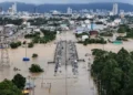 Rescue workers navigating flooded street in southern Thailand after heavy rainfall - REUTERS/Weerapong Narongkul