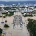 Rescue workers navigating flooded street in southern Thailand after heavy rainfall - REUTERS/Weerapong Narongkul