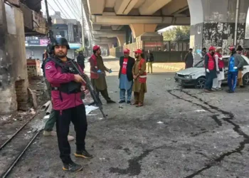 Pakistani security forces respond to suicide bombing at Peshawar headquarters - AP Photo/Muhammad Zubair