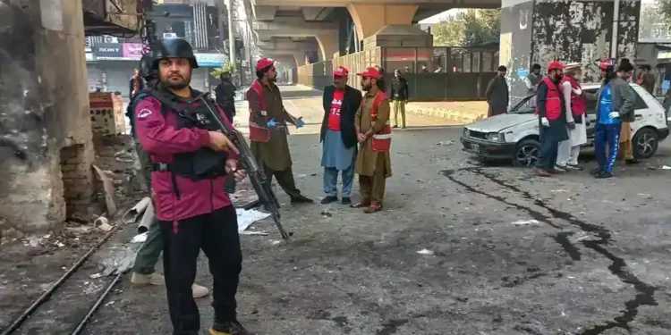 Pakistani security forces respond to suicide bombing at Peshawar headquarters - AP Photo/Muhammad Zubair