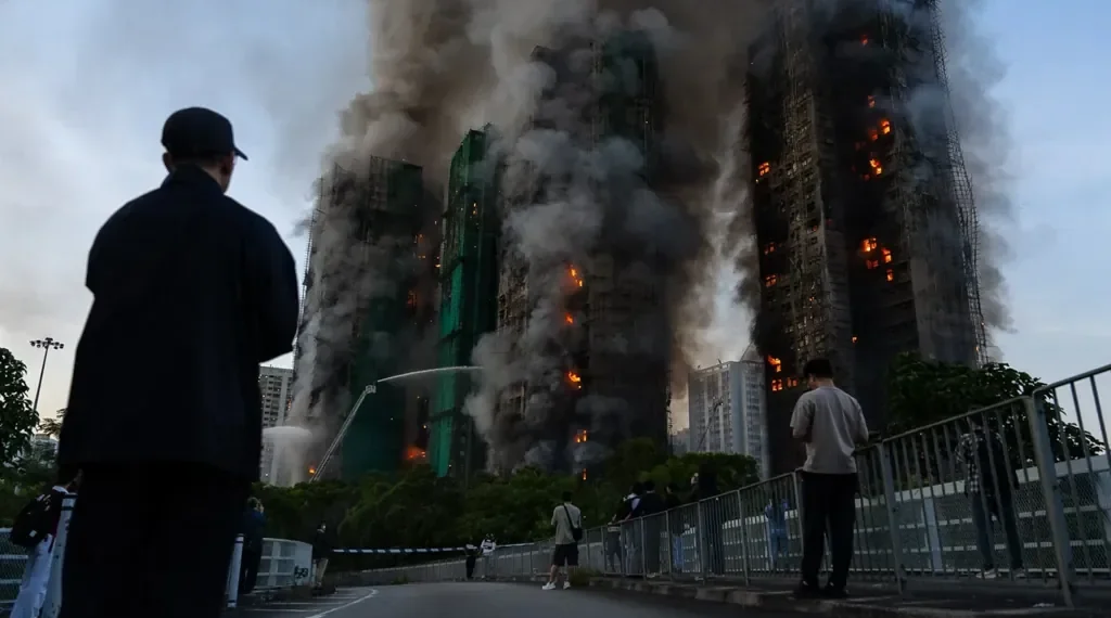 Fire crews battle smoke at burning Hong Kong high-rise residential towers - AP Photo/Chan Long Hei