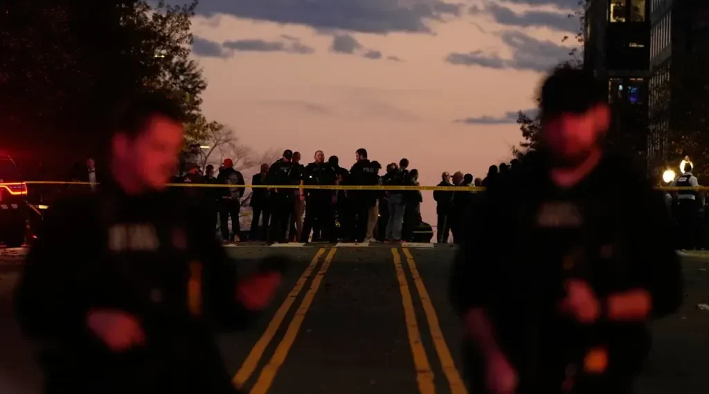 National Guard officers stand near security barriers in Washington - AP Photo/Mark Schiefelbein