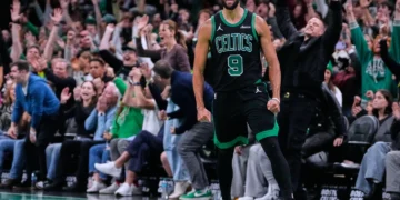 Boston Celtics players celebrate win over Detroit Pistons - AP Photo/Charles Krupa