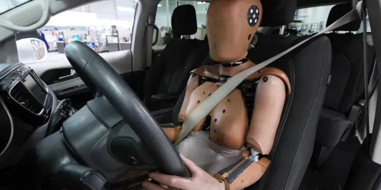 U.S. Endorses Lifelike Female Crash Test Dummy to Improve Car Safety Ratings and Reduce Injury Risks for Women Drivers - AP Photo/Paul Sancya, File
